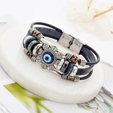 Serenemyst Stainless Steel Turkish Blue Eye Eight-Petal Flower Cow Leather Cord Clasp Bracelet